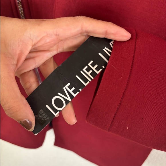 Red Utility Jacket with Asymmetrical Zipper and Minimalist Design - Picture 4 of 12